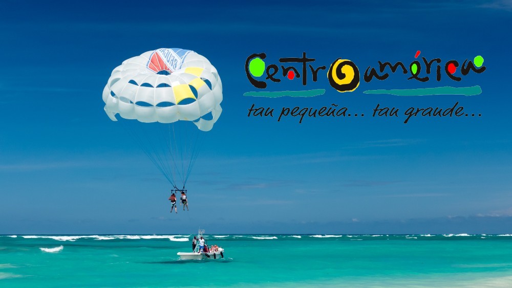 playa dominicana, parasailing y bañistas, logo de CATA