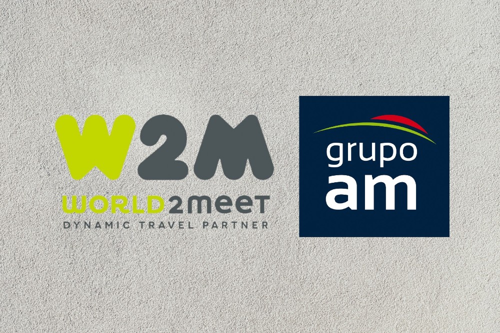 logos de World2Meet y Grupo AM sobre un fondo gris